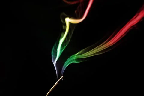Colored smoke on a black background Stock Photos
