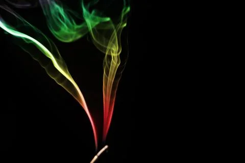 Colored smoke on a black background Stock Photos