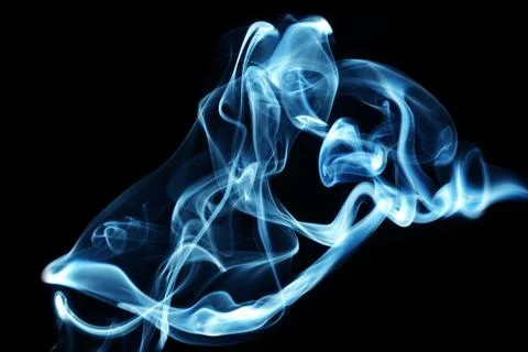 Colored smoke on a black background Stock Photos