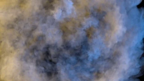 Colored smoke in circular motion, expands towards the camera. Twisting smoke. Stock Footage 82468646