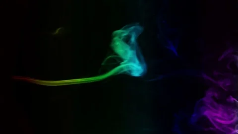 Colored smoke curves isolated on black background Stock Footage 82130255