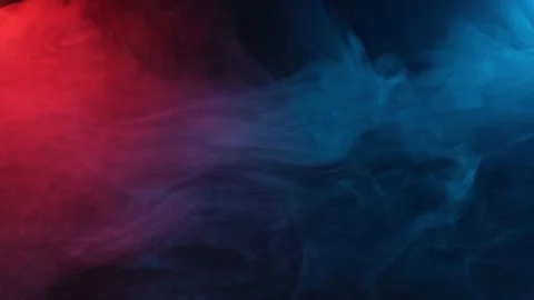 Colored smoke on a dark background. Blue... | Stock Video | Pond5