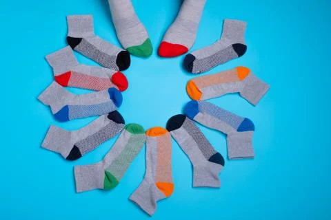 Colored socks in a around on a blue background Stock Photos
