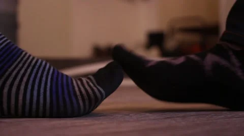 Colored Socks, Striped and Patterned. Feet Fighting With Each Other. Stock Footage 68722387