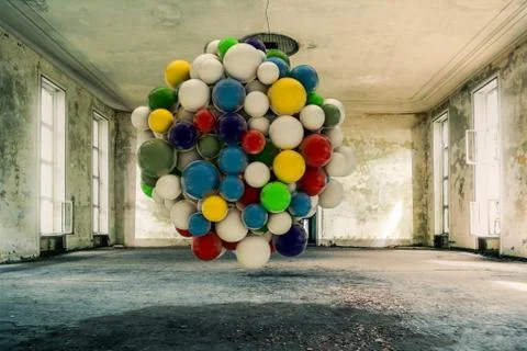 Colored spheres intallation inside an empty room Stock Illustration