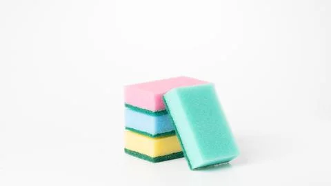 Colored sponges in a stack on a white background of the object Stock Photos