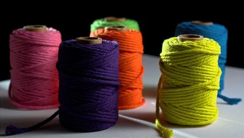 Colored spools of thread on a white background, sewing, space for text Stock Photos
