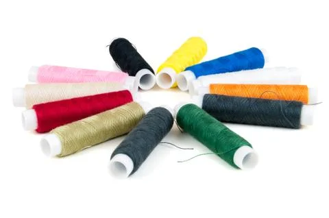 Colored spools of threads on white background Stock Photos
