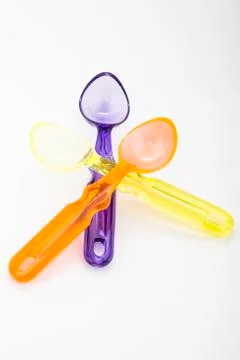 Colored spoons Stock Photos