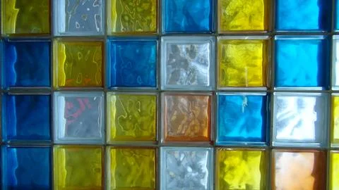 Colored square glass cubes embedded in the building Stock Photos