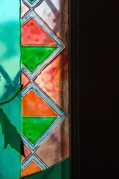 Colored stained glass. Geometric patterns on glass. Foto stock