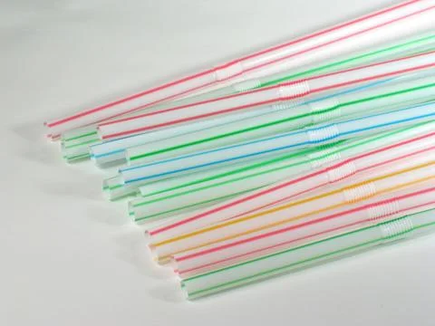 Colored straws over white background Stock Photos