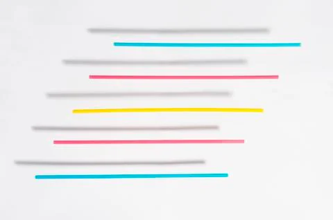 Colored straws with shadow floating above a white background 스톡 사진