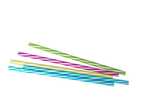 Colored striped plastic drinking straws, white background Stock Photos