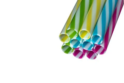 Colored striped plastic drinking straws, white background Stock Photos
