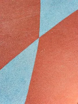 Colored surface with geometric patterns at a playground during daytime Stock Photos
