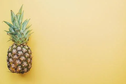 Colored surface with pineapple High resolution photo Stock Photos
