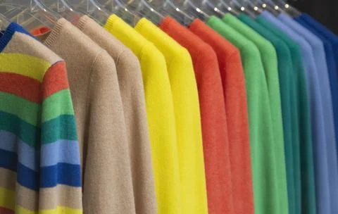 Colored Sweaters In Rack Of Sale Stock Photos