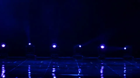 Colored theatrical light spots turning around Stock Footage 34868865