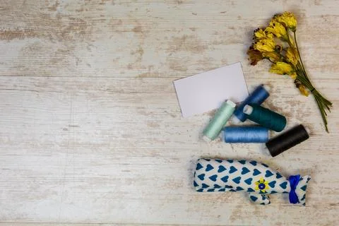 Colored thread and hand-made toys, top view. Stock Photos