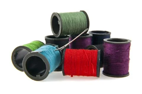 Colored thread and needle isolated on white background Stock Photos