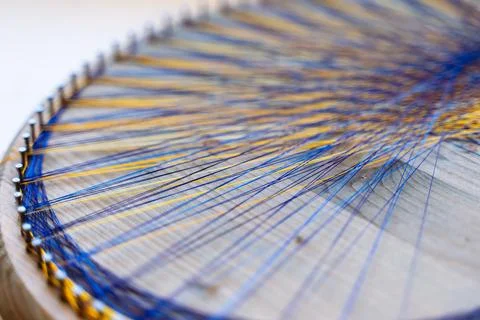 Colored thread mandala on a wooden board with nails. Mandala Moon Harmony Sun Stock Photos