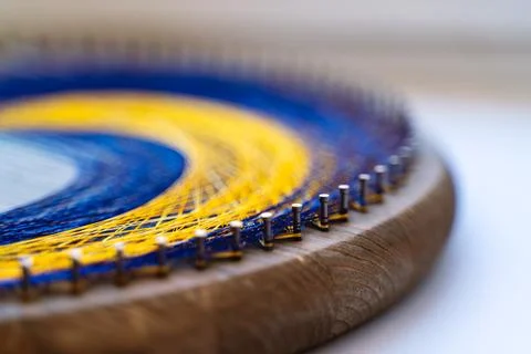 Colored thread mandala on a wooden board with nails. Mandala Moon Harmony Sun Stock Photos