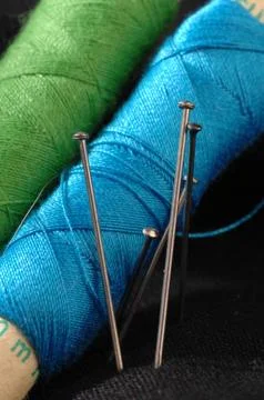 Colored thread on material Stock Photos