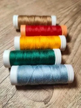Colored thread spools Stock Photos