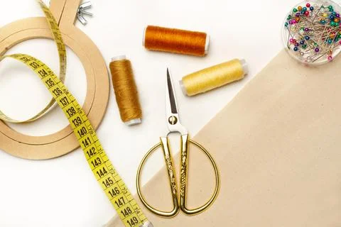 Colored thread spools, scissors and a embroidery hook Stock Photos