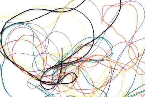 Colored thread tangled on a white background Stock Photos