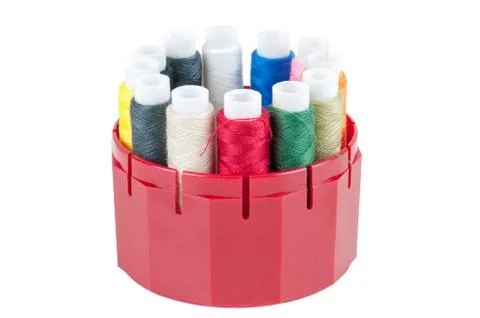 Colored threads in a box on white background Stock Photos