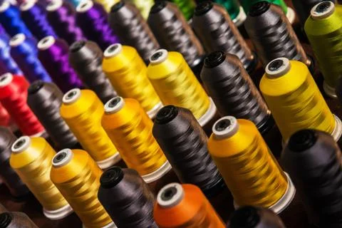 Colored Threads on industrial spindles Stock Photos