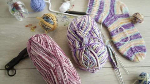 Colored threads, knitting needles and other items for hand knitting Stock Footage 233380541