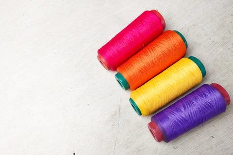 Colored threads lined up on a white background Stock Photos