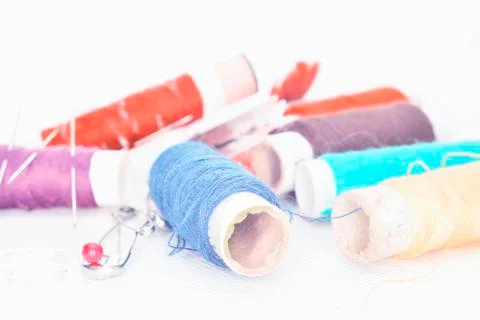 Colored threads with needles and blade Stock Photos
