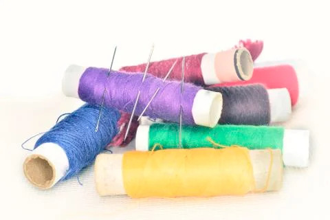 Colored threads with needles and blade Stock Photos