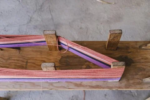 Colored threads put on the loom to weave - interwoven threads Stock Photos