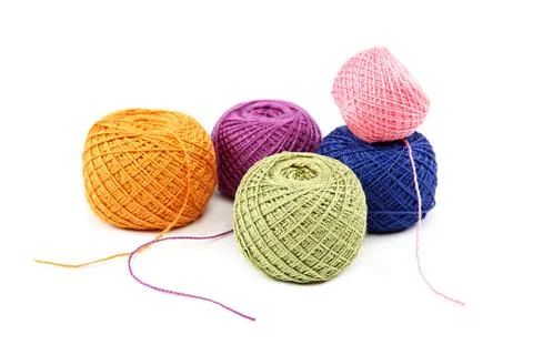Colored threads on white background. Stock Photos