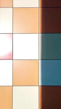 Colored Tiles Creating Intricate Patterns and Shadows in a Well-Lit Space D.. Stock Photos