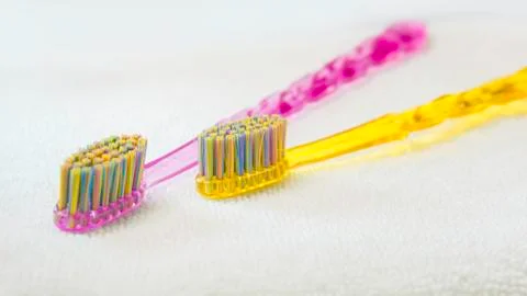 Colored Tooth brushes  isolated on the white background. Stock Photos