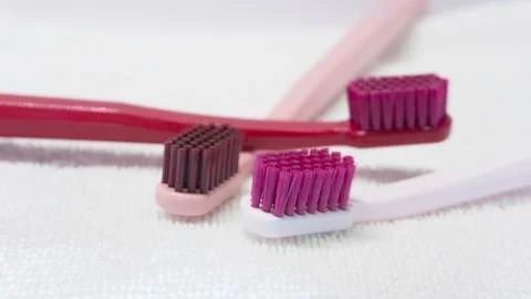 Colored Tooth brushes  isolated on the white background. Stock Photos