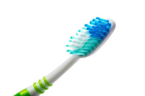 Colored toothbrush on an isolated background, close up Stock Photos
