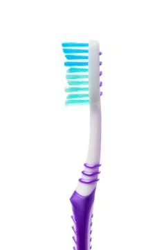 Colored toothbrush on an isolated background, close up Stock Photos