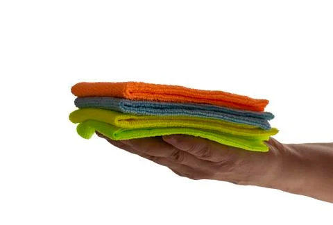 Colored towels in hand. Stock Photos