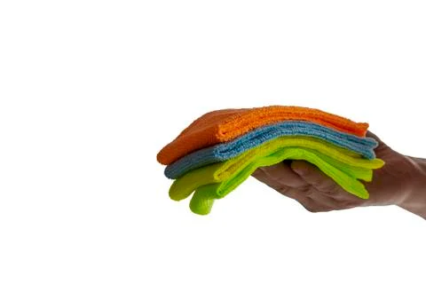 Colored towels in hand. Stock Photos