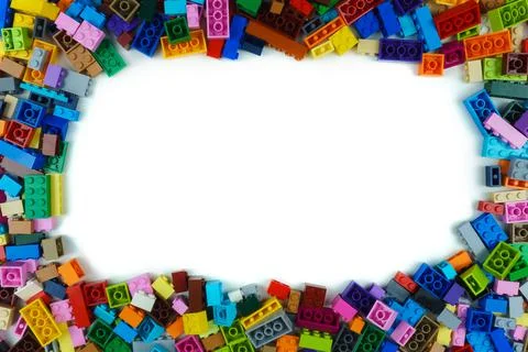 Colored toy bricks with copy space in the center Stock Photos