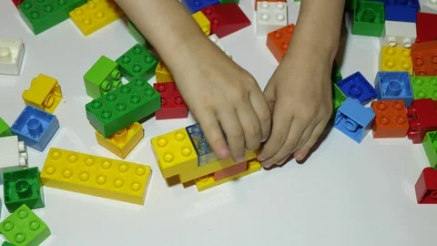 Colored toy bricks on the floor Video stock 116649400