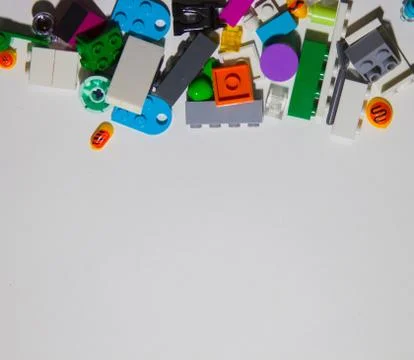 Colored toy bricks on white background. Playing lego concept. Stock Photos