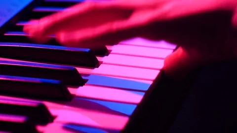 Colored Tracking Shot Of Hands Playing Piano Stock Footage 71360700